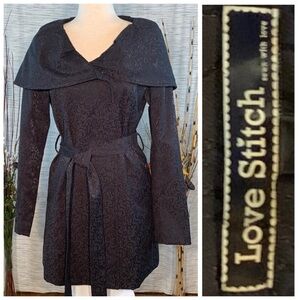 Love Stitch black coat with black floral inlay design.